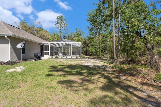 view of yard with a lanai