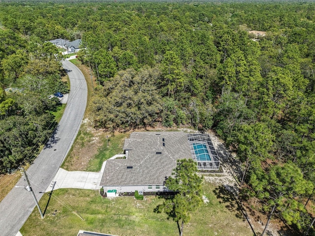 bird's eye view featuring a forest view