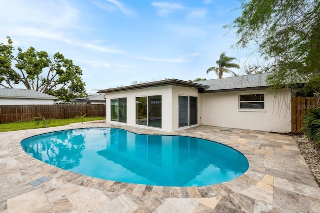 1886 San Mateo Dr, Dunedin, FL 34698 - view of swimming pool featuring a fenced in pool, a fenced backyard, and a patio