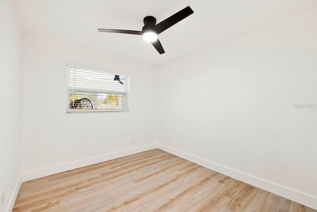 1886 San Mateo Dr, Dunedin, FL 34698 - empty room featuring wood finished floors, baseboards, and ceiling fan