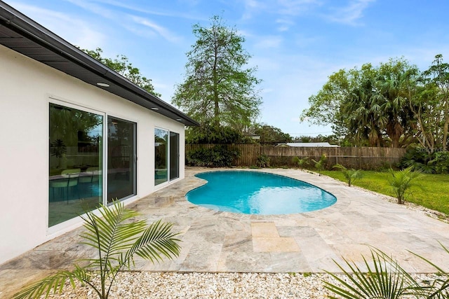 1886 San Mateo Dr, Dunedin, FL 34698 - view of swimming pool featuring a patio area, a fenced backyard, and a fenced in pool