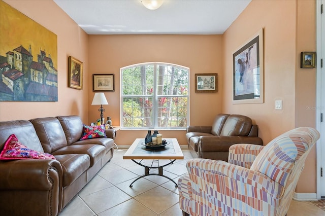 living room featuring baseboards and tile patterned flooring