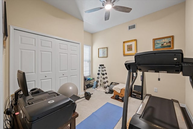 exercise room featuring carpet floors, visible vents, and ceiling fan
