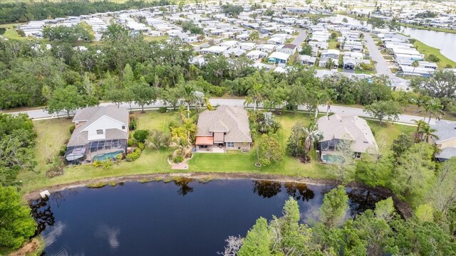 birds eye view of property featuring a water view and a residential view