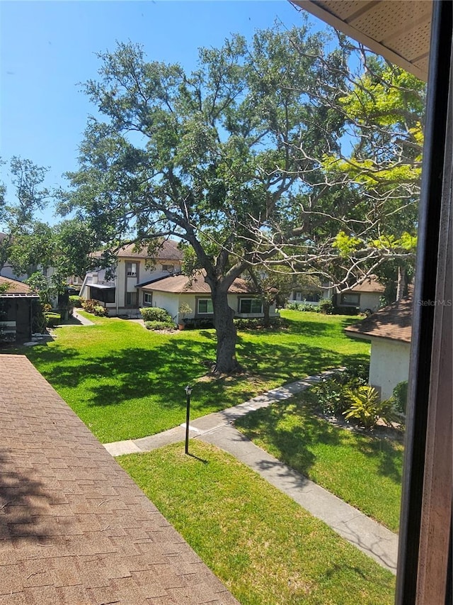 surrounding community with a yard