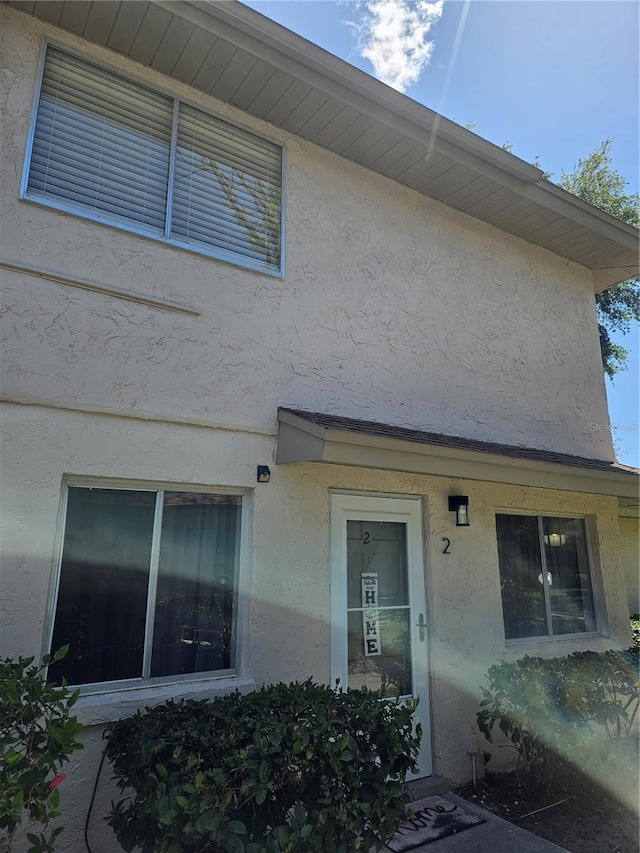 exterior space with stucco siding