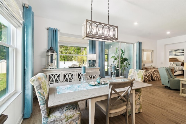 dining space with recessed lighting, wood finished floors, and a healthy amount of sunlight