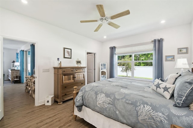 bedroom featuring ceiling fan, recessed lighting, wood finished floors, and baseboards