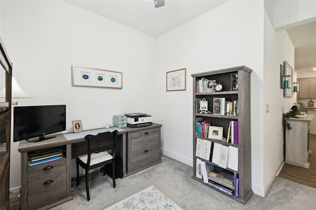 office area with baseboards and carpet floors