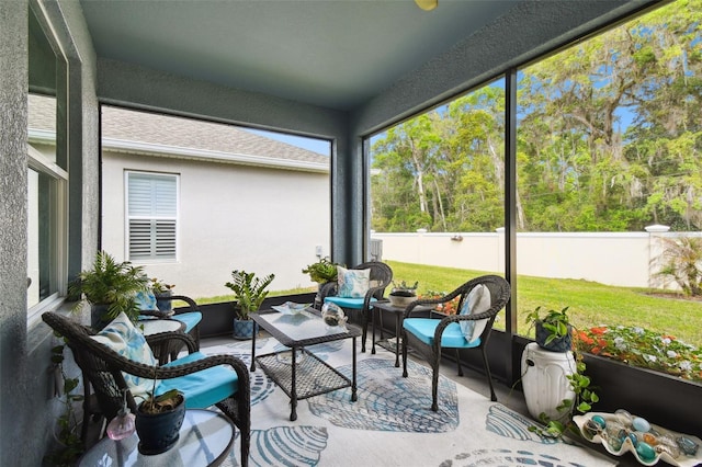 sunroom with an outdoor living space