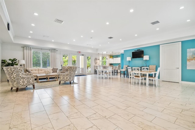 living area with marble finish floor, visible vents, and recessed lighting