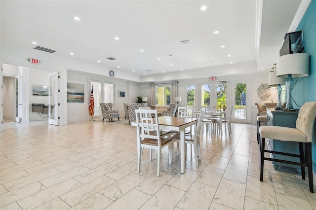 dining room featuring french doors, recessed lighting, and visible vents