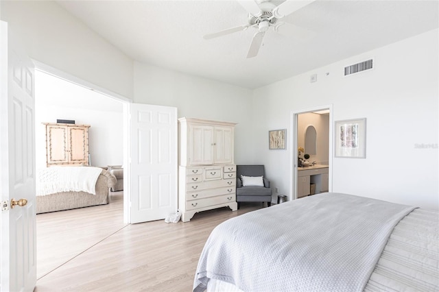 bedroom featuring light wood-style flooring, ceiling fan, and visible vents