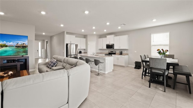 33581 Elm Hill Br, Wesley Chapel, FL 33545 - living area with recessed lighting, baseboards, and light tile patterned flooring