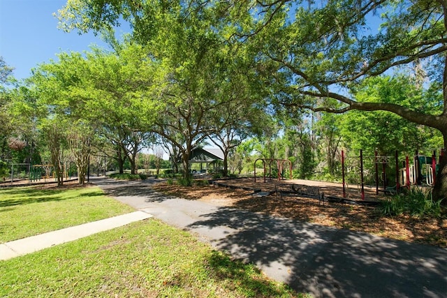 view of property's community featuring a yard