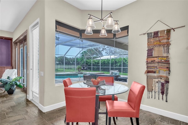 5807 Thoreau Pl, Lithia, FL 33547 - dining space with a sunroom, baseboards, and stone finish flooring