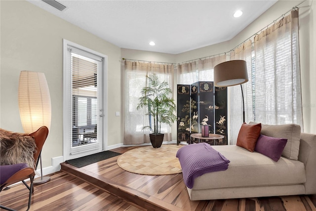 5807 Thoreau Pl, Lithia, FL 33547 - living area with wood finished floors, baseboards, and recessed lighting