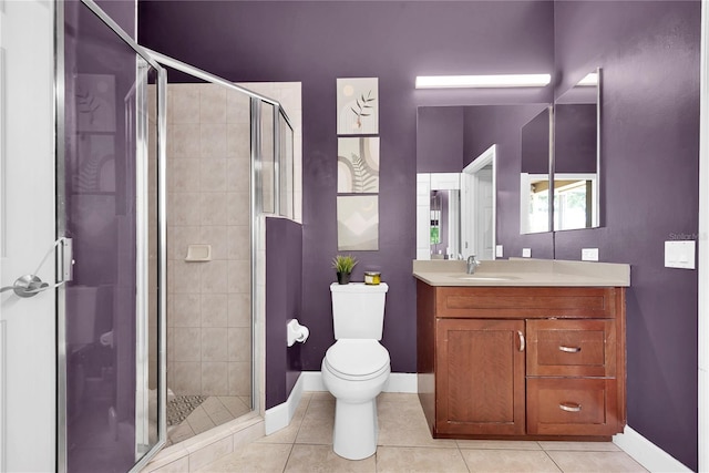 5807 Thoreau Pl, Lithia, FL 33547 - full bath featuring baseboards, vanity, tile patterned flooring, and toilet