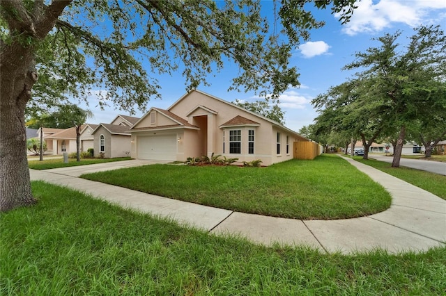 11626 Pure Pebble Dr, Riverview, FL 33569 - ranch-style house featuring stucco siding, a garage, a front yard, and concrete driveway
