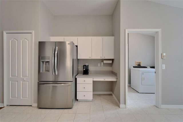 11626 Pure Pebble Dr, Riverview, FL 33569 - kitchen featuring stainless steel refrigerator with ice dispenser, light countertops, white cabinets, baseboards, and light tile patterned flooring
