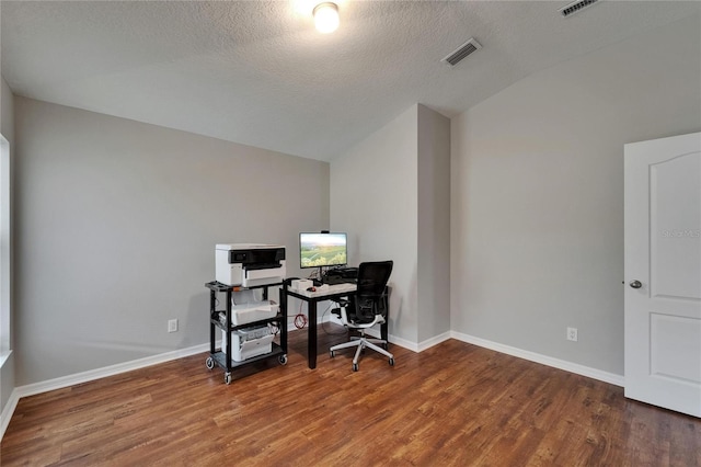 11626 Pure Pebble Dr, Riverview, FL 33569 - home office featuring vaulted ceiling, wood finished floors, baseboards, and a textured ceiling