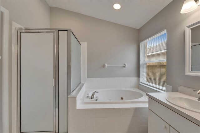 11626 Pure Pebble Dr, Riverview, FL 33569 - bathroom with a whirlpool tub, a stall shower, vanity, and vaulted ceiling