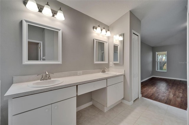 11626 Pure Pebble Dr, Riverview, FL 33569 - full bath featuring double vanity, tile patterned floors, and baseboards