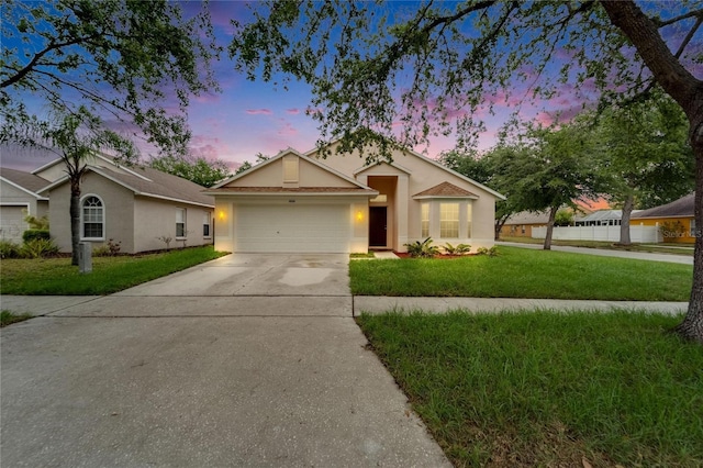 11626 Pure Pebble Dr, Riverview, FL 33569 - ranch-style home featuring concrete driveway, an attached garage, a front yard, and stucco siding