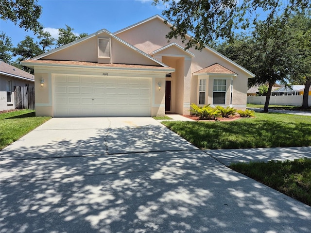 11626 Pure Pebble Dr, Riverview, FL 33569 - view of front facade with stucco siding, concrete driveway, and an attached garage