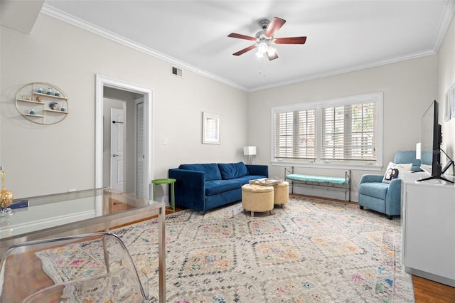 2117 W Dekle Ave Unit H1, Tampa, FL 33606 - living room featuring ornamental molding, visible vents, ceiling fan, and wood finished floors