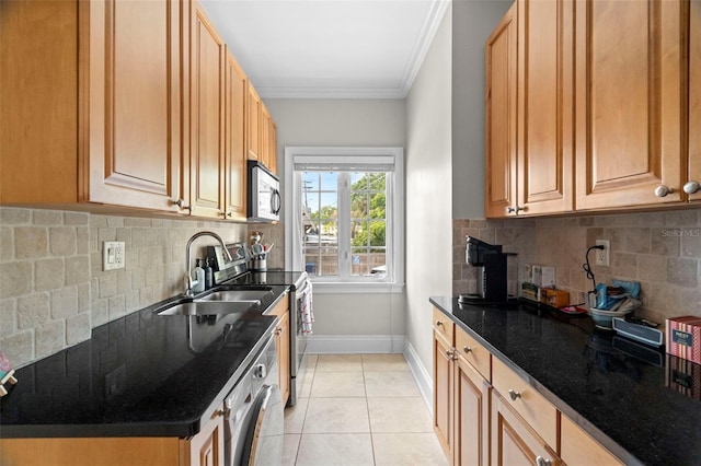 2117 W Dekle Ave Unit H1, Tampa, FL 33606 - kitchen featuring baseboards, light tile patterned floors, crown molding, appliances with stainless steel finishes, and a sink
