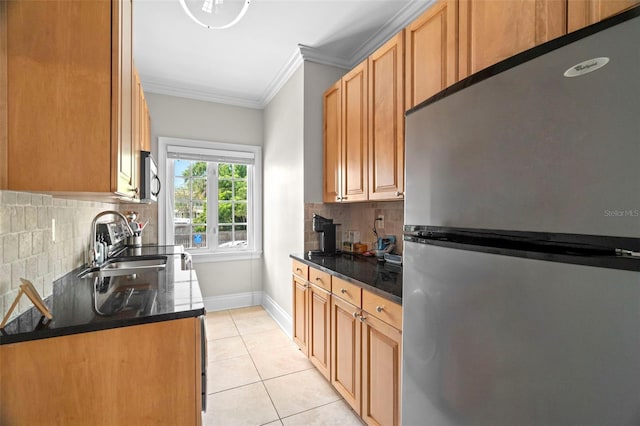 2117 W Dekle Ave Unit H1, Tampa, FL 33606 - kitchen with tasteful backsplash, light tile patterned floors, a sink, crown molding, and stainless steel appliances