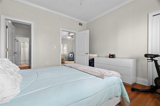 2117 W Dekle Ave Unit H1, Tampa, FL 33606 - bedroom featuring visible vents, baseboards, crown molding, and wood finished floors