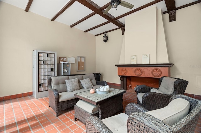 2117 W Dekle Ave Unit H1, Tampa, FL 33606 - living area with beamed ceiling, baseboards, a ceiling fan, and tile patterned floors