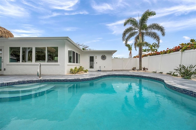 view of pool with a patio area, fence, and a fenced in pool