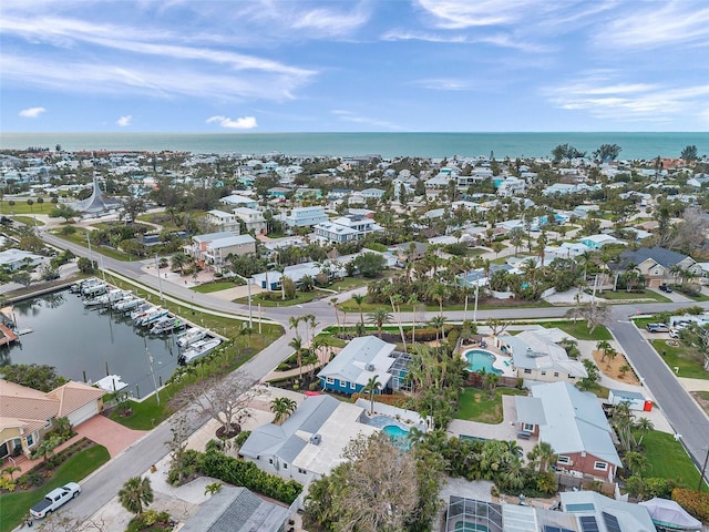 bird's eye view with a water view and a residential view
