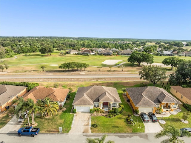 birds eye view of property with a residential view and golf course view