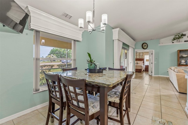 dining area featuring visible vents, vaulted ceiling, baseboards, an inviting chandelier, and light tile patterned flooring