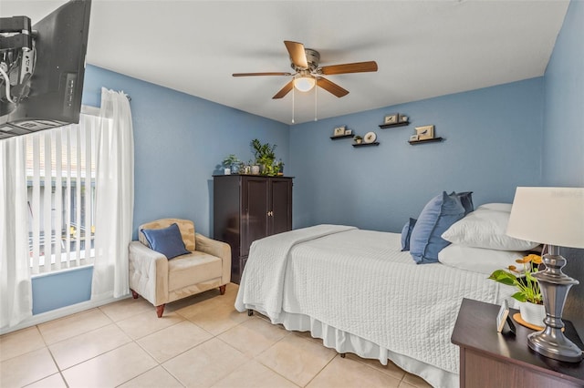 bedroom with tile patterned flooring and ceiling fan