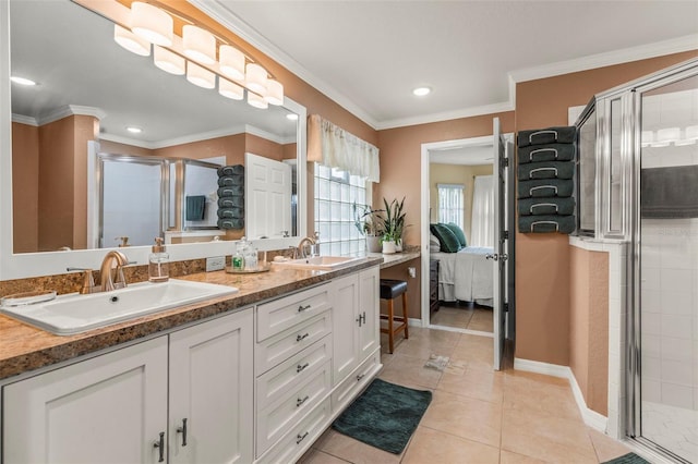 ensuite bathroom featuring a sink, tile patterned flooring, ensuite bathroom, and a stall shower