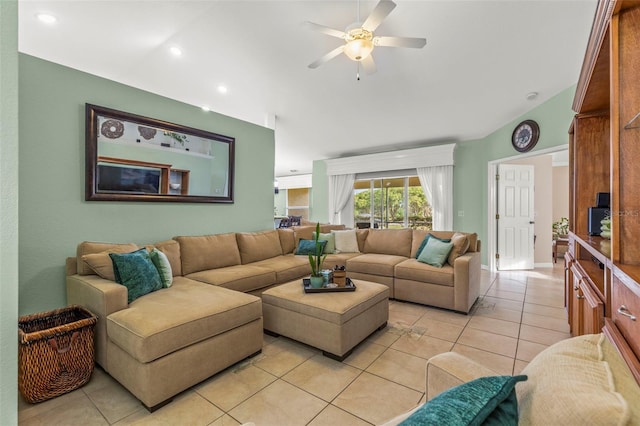 living room featuring vaulted ceiling, a ceiling fan, light tile patterned floors, and recessed lighting