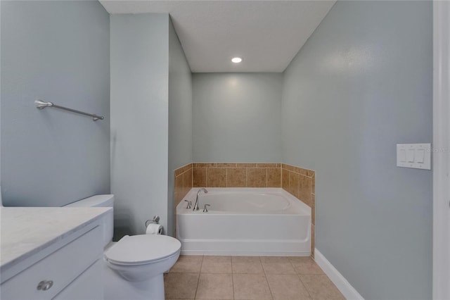 bathroom with a bath, baseboards, toilet, vanity, and tile patterned floors