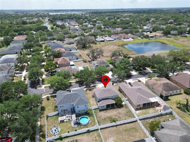 birds eye view of property featuring a residential view and a water view