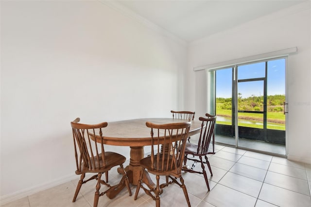 8953 Gallantree Pl, Land O Lakes, FL 34637 - dining space with baseboards, crown molding, and light tile patterned flooring