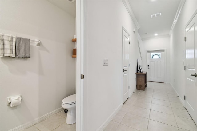 8953 Gallantree Pl, Land O Lakes, FL 34637 - bathroom featuring visible vents, baseboards, toilet, crown molding, and tile patterned floors