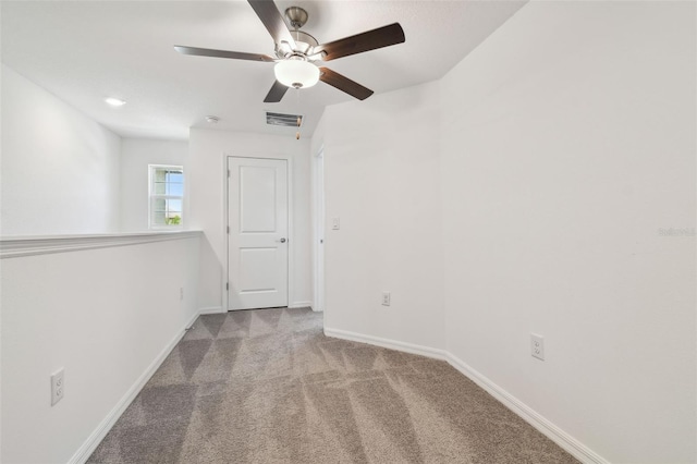 8953 Gallantree Pl, Land O Lakes, FL 34637 - spare room with visible vents, baseboards, a ceiling fan, and carpet flooring