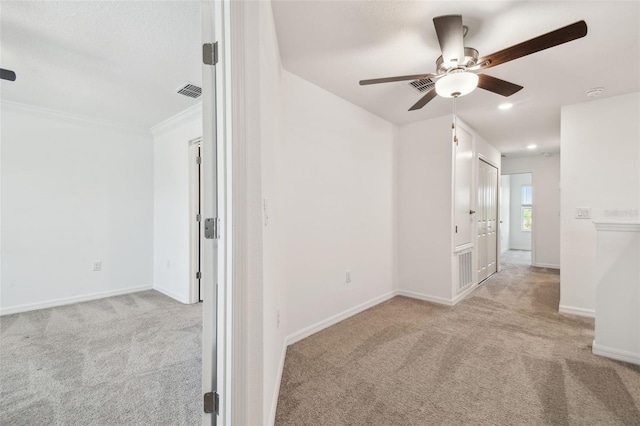 8953 Gallantree Pl, Land O Lakes, FL 34637 - carpeted empty room with ornamental molding, visible vents, ceiling fan, and baseboards