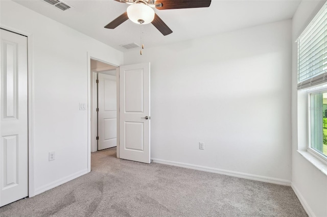 8953 Gallantree Pl, Land O Lakes, FL 34637 - unfurnished bedroom with light colored carpet, baseboards, and visible vents