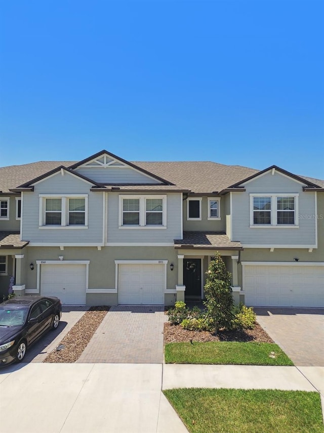 8953 Gallantree Pl, Land O Lakes, FL 34637 - view of front of home featuring driveway and a garage