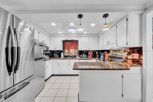 8115 N Ola Ave, Tampa, FL 33604 - kitchen with light tile patterned floors, a sink, a peninsula, stainless steel appliances, and decorative backsplash